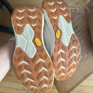 Hoka Trail Shoes with Gum Brown Outsoles and White Upper Accents